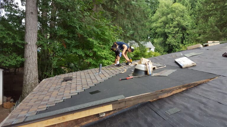 A pic of contractor doing Asphalt Shingle Roof Replacement 