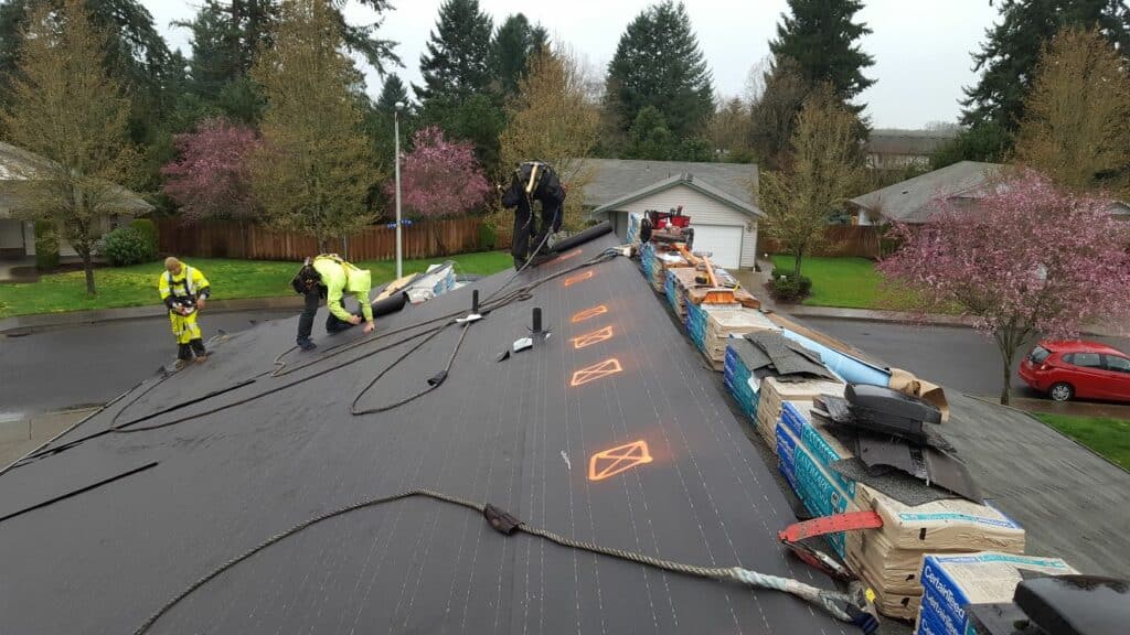 Professional contractor working on a residential roofing in Lake Oswego